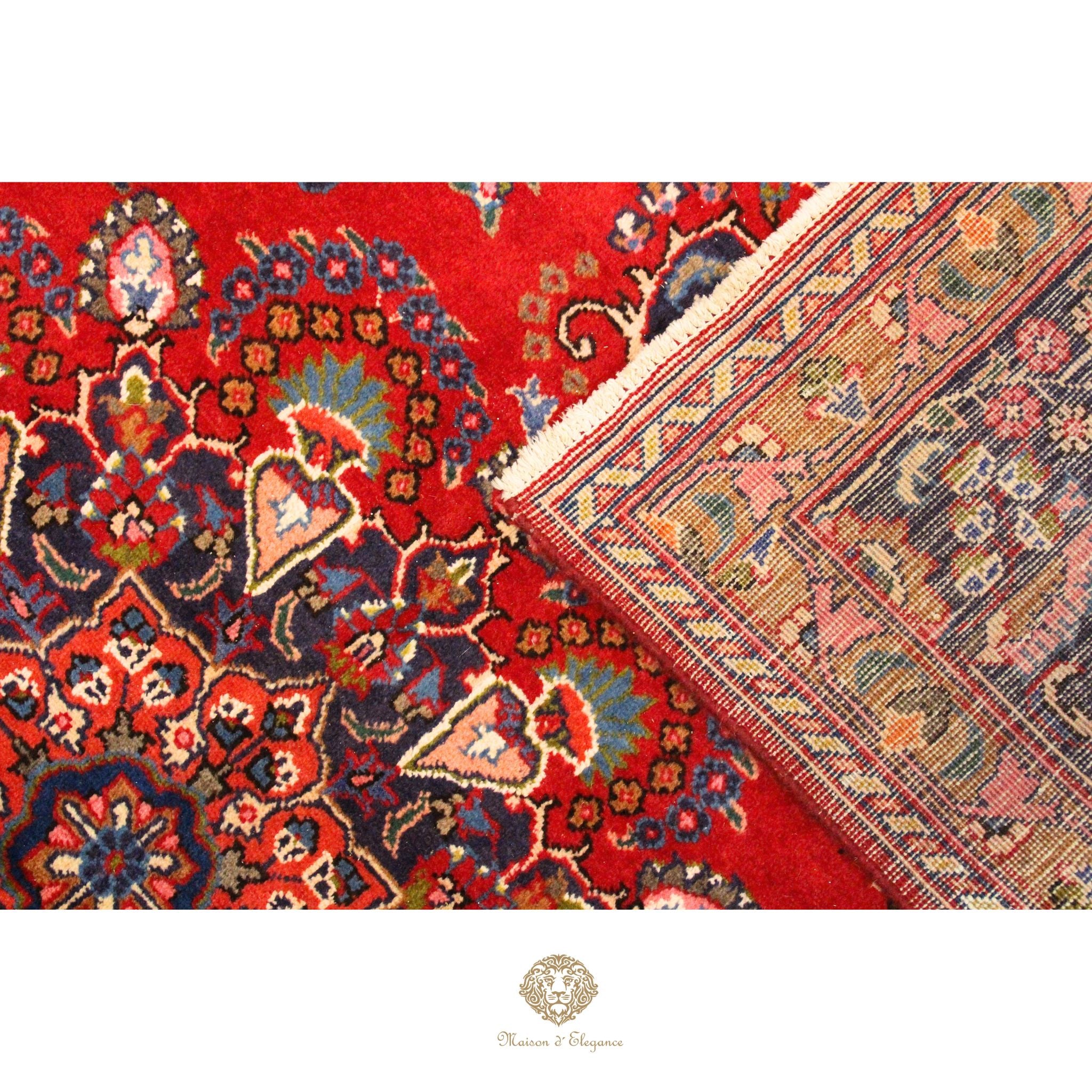 Close-up of a red patterned rug with intricate designs on a white background.