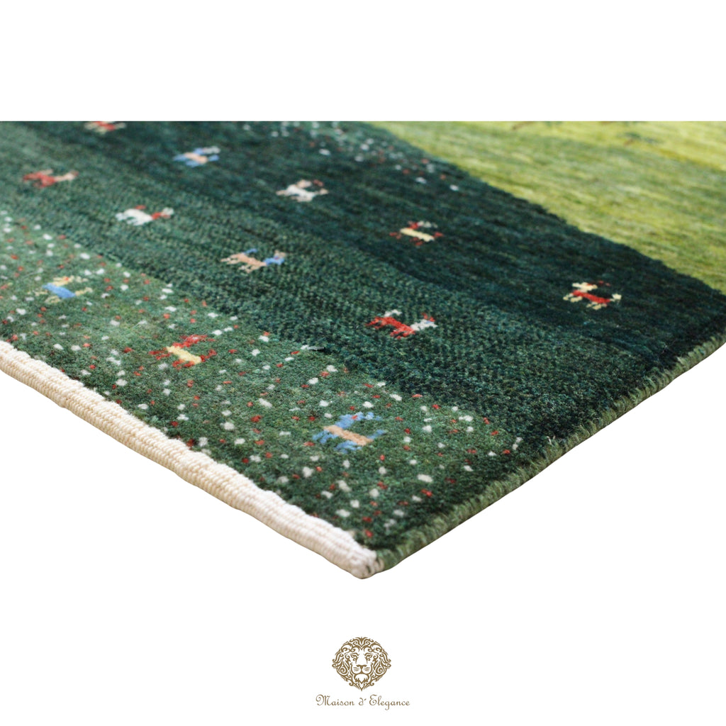 Green patterned rug with a brand logo in the corner