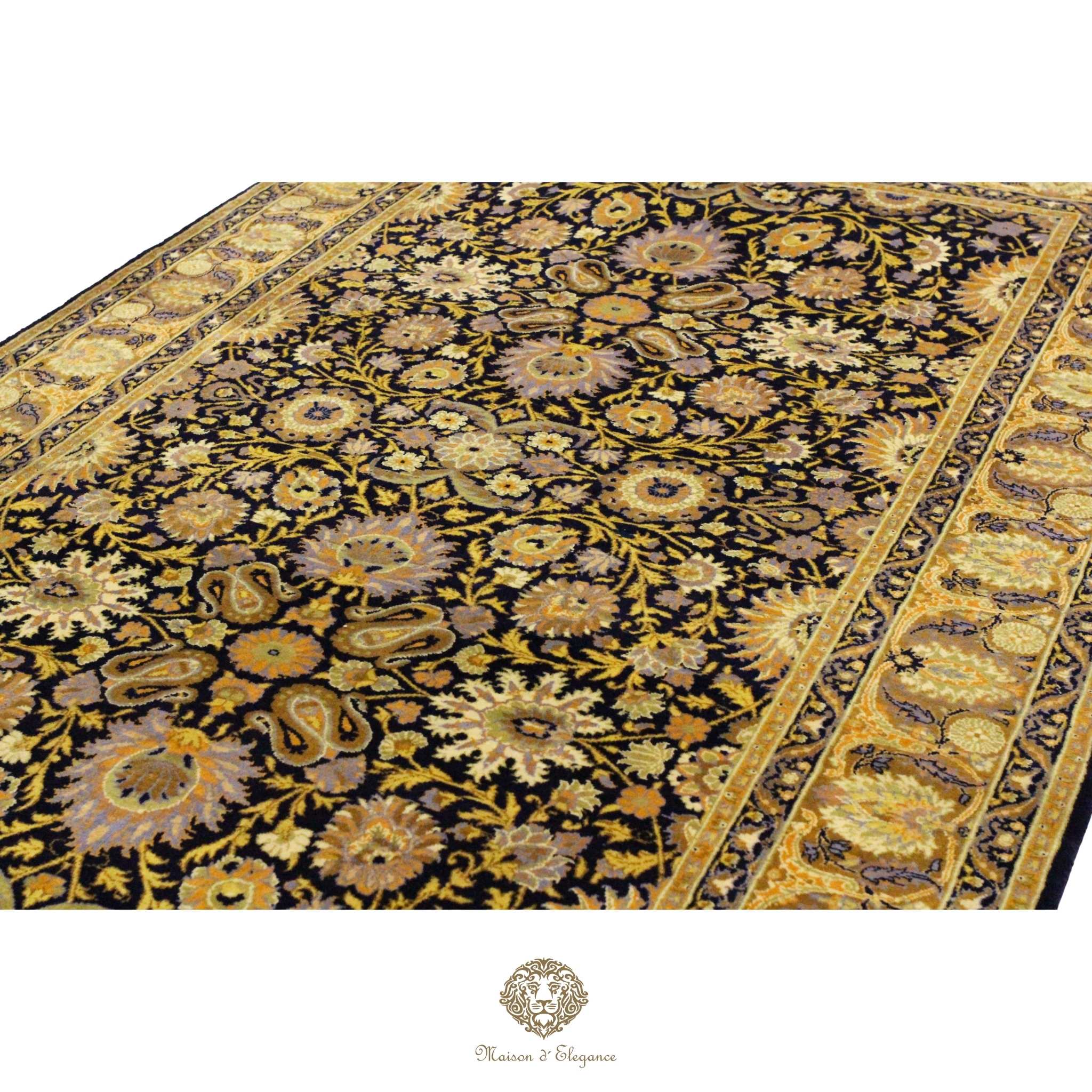 Close-up of a patterned fabric with intricate designs on a navy background