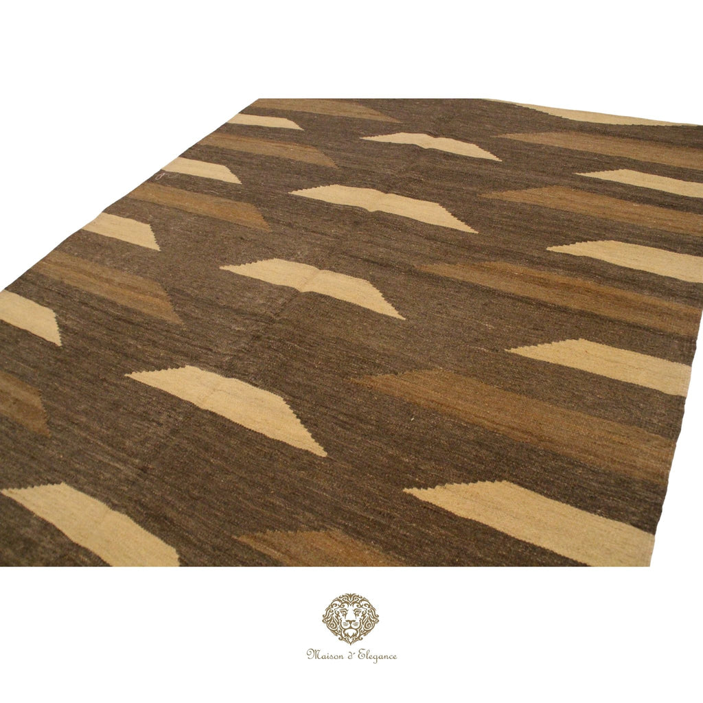 Patterned rug with brown and beige colors on a brown background