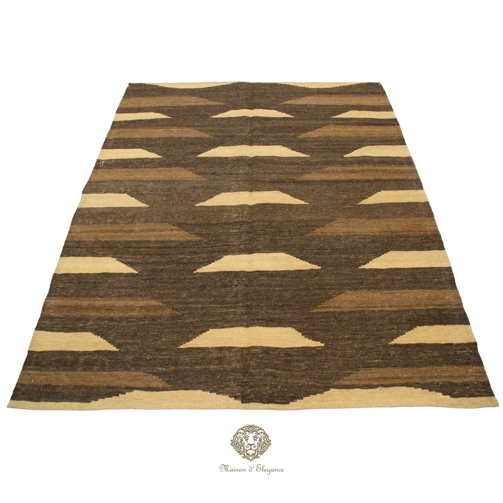Rug with brown and beige geometric pattern on a brown background