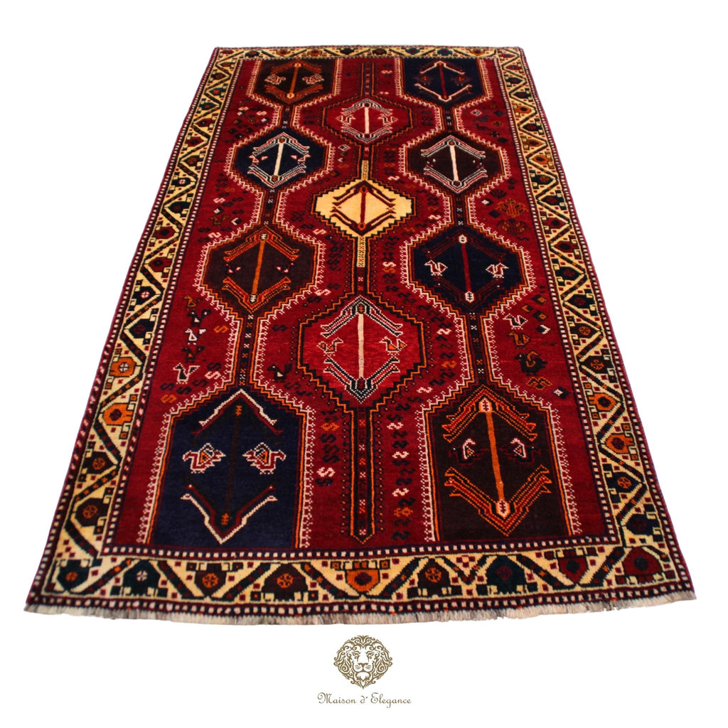Decorative rug with geometric pattern on a red background