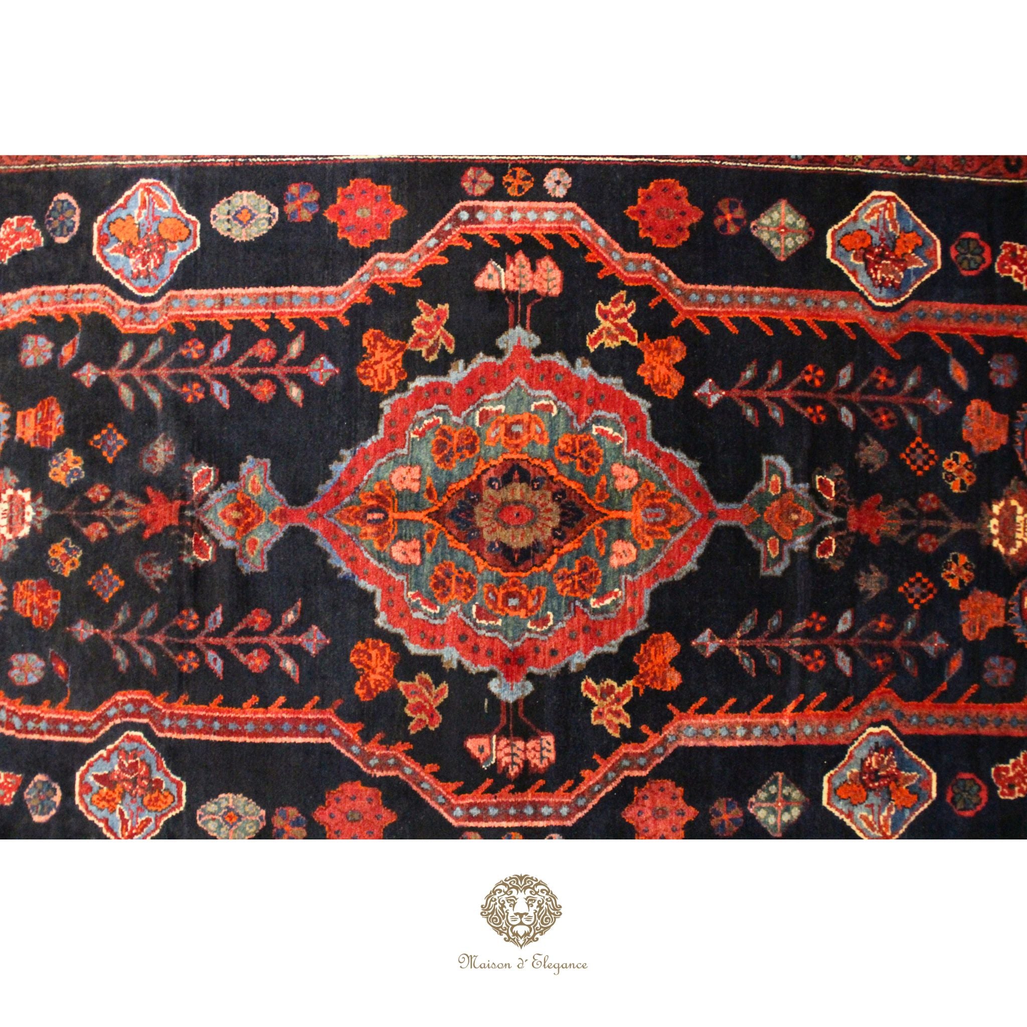 Close-up of an ornate rug with intricate patterns on a dark background